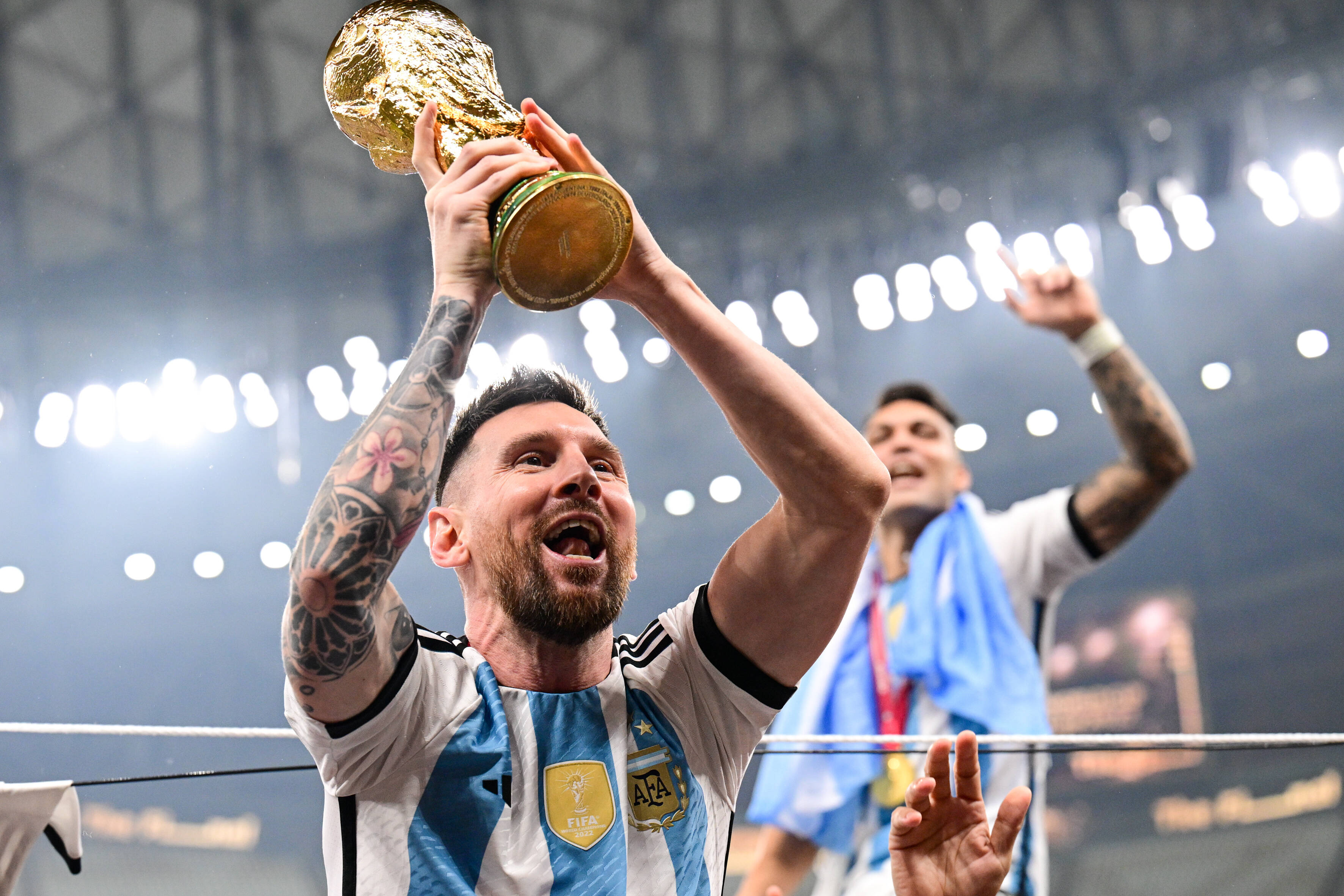 Lionel Messi holds the World Cup trophy after Argentina's victory in the 2022 final.