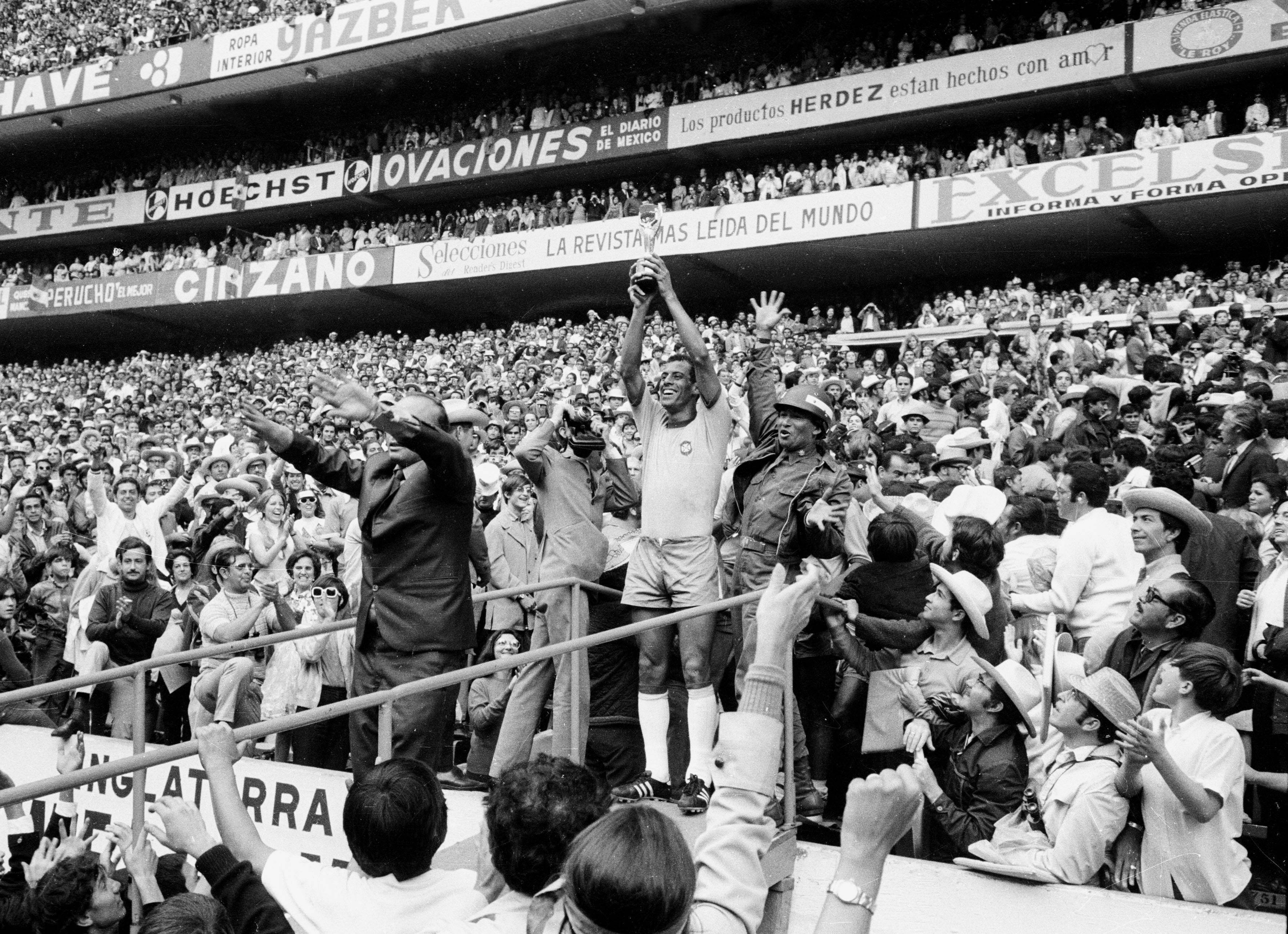 Carlos Alberto of Brazil holds up the Jules Rimet Trophy after winning the 1970 World Cup final.